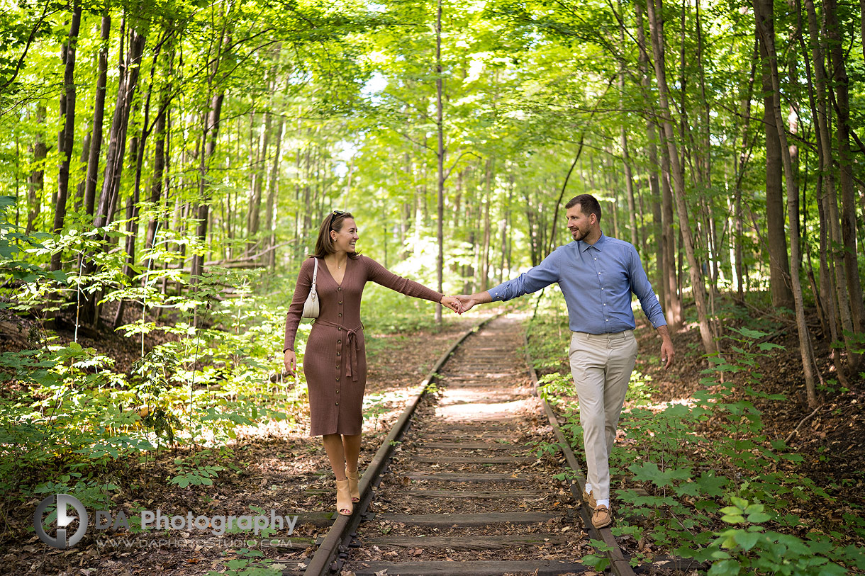 Intimate proposal photo in Milton on the rail tracks at Mill Pond
