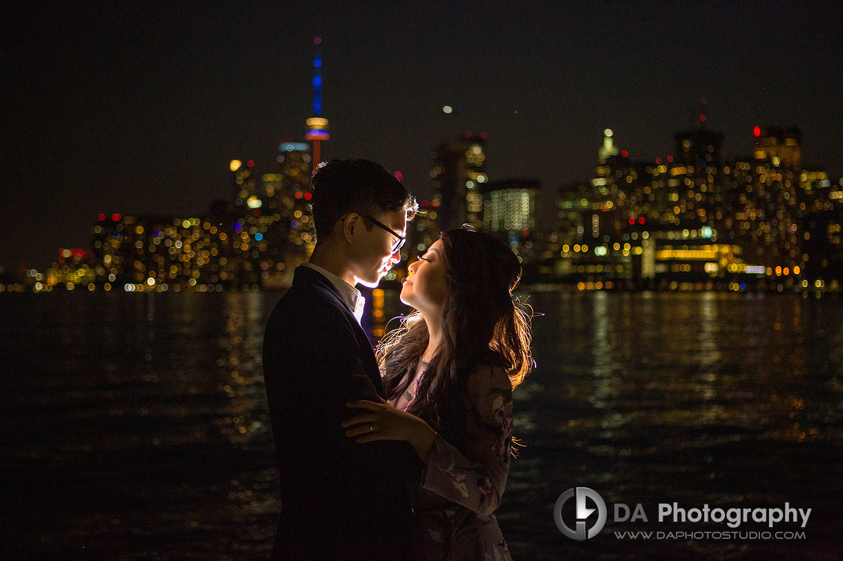 Intimate photo of a couple with Toronto City Skyline in the back