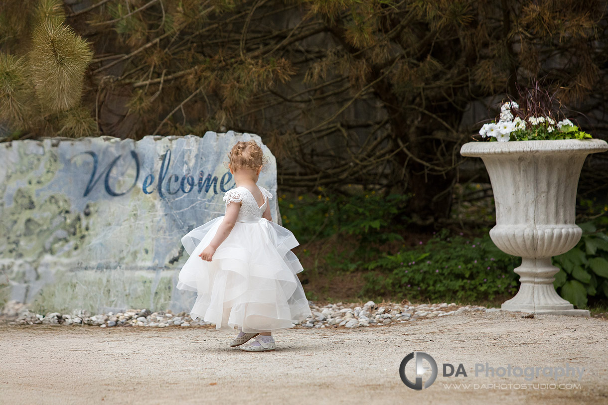 Flower girl in front of the welcome sign CJ Country Events Flower girl in front of the welcome sign CJ Country Events