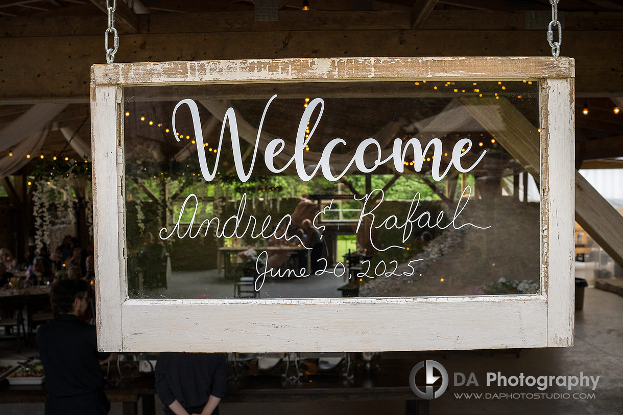 Photo of a vintage window frame turn into wedding reception sign with bride and groom's names Photo of a vintage window frame turn into wedding reception sign with bride and groom's names
