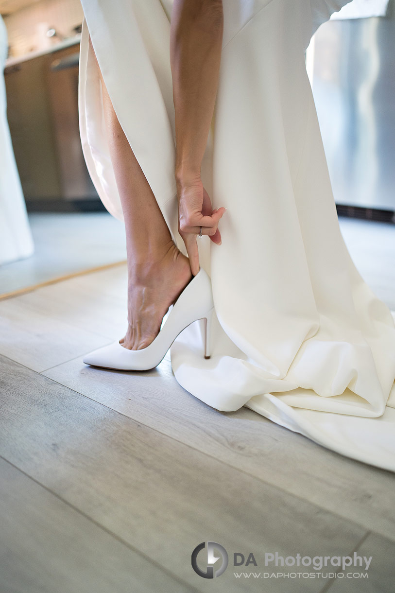 Bride putting her wedding shoes Bride putting her wedding shoes