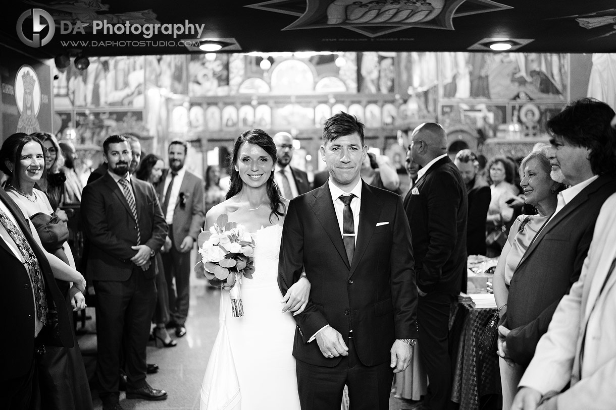 Photo of a Bride and Groom exiting a church Photo of a Bride and Groom exiting a church