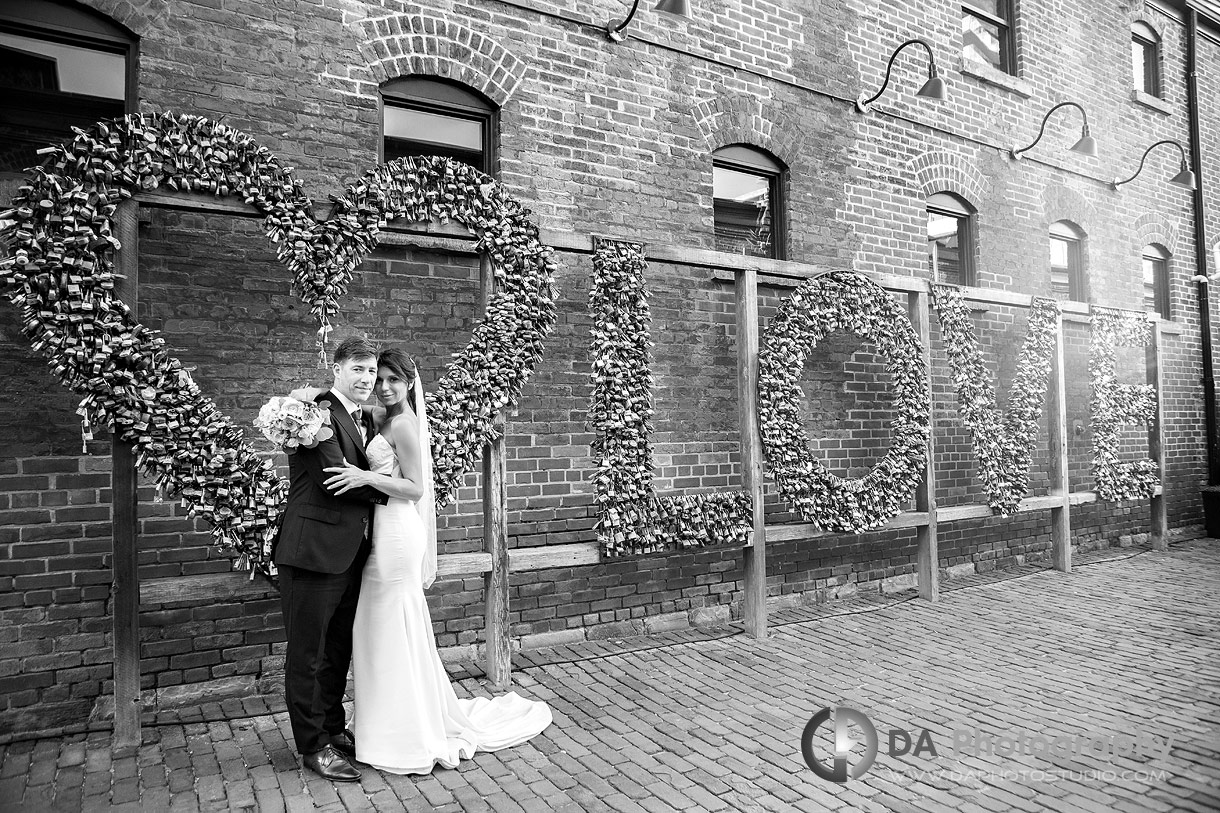 Wedding photo by the LOVE sign at Distillery District in Toronto Wedding photo by the LOVE sign at Distillery District in Toronto