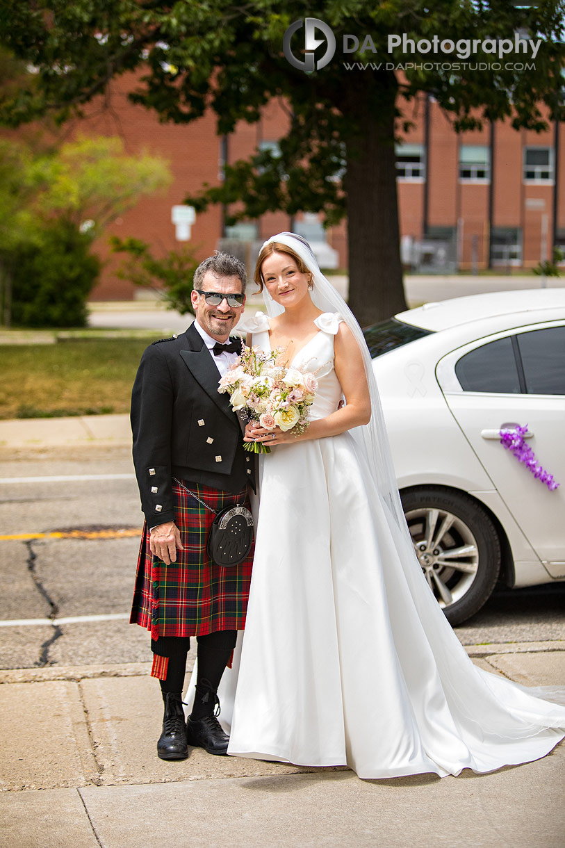 Bride with her dad in front of St. Mary’s Church in Kitchener