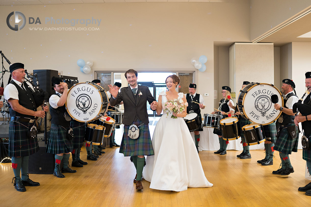 Fergus Pipe Band plays during Bride and Groom entering an wedding reception at Alma Community Centre