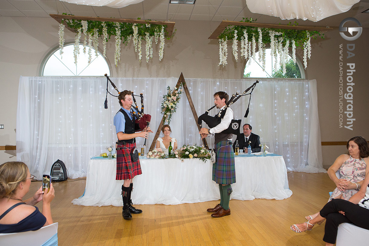 Groom performing on a pipe during his Wedding Reception at Alma Community Centre