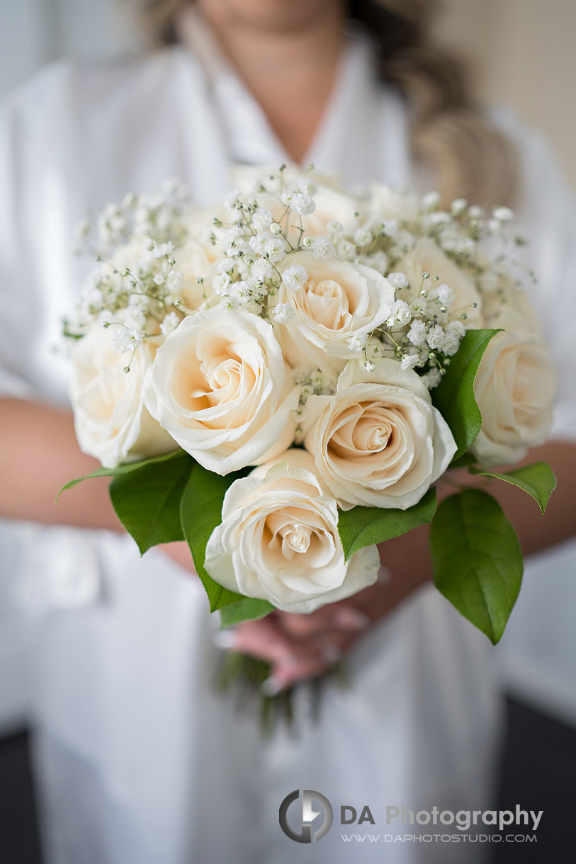 Photo of a bride holing her wedding flowers Photo of a bride holing her wedding flowers