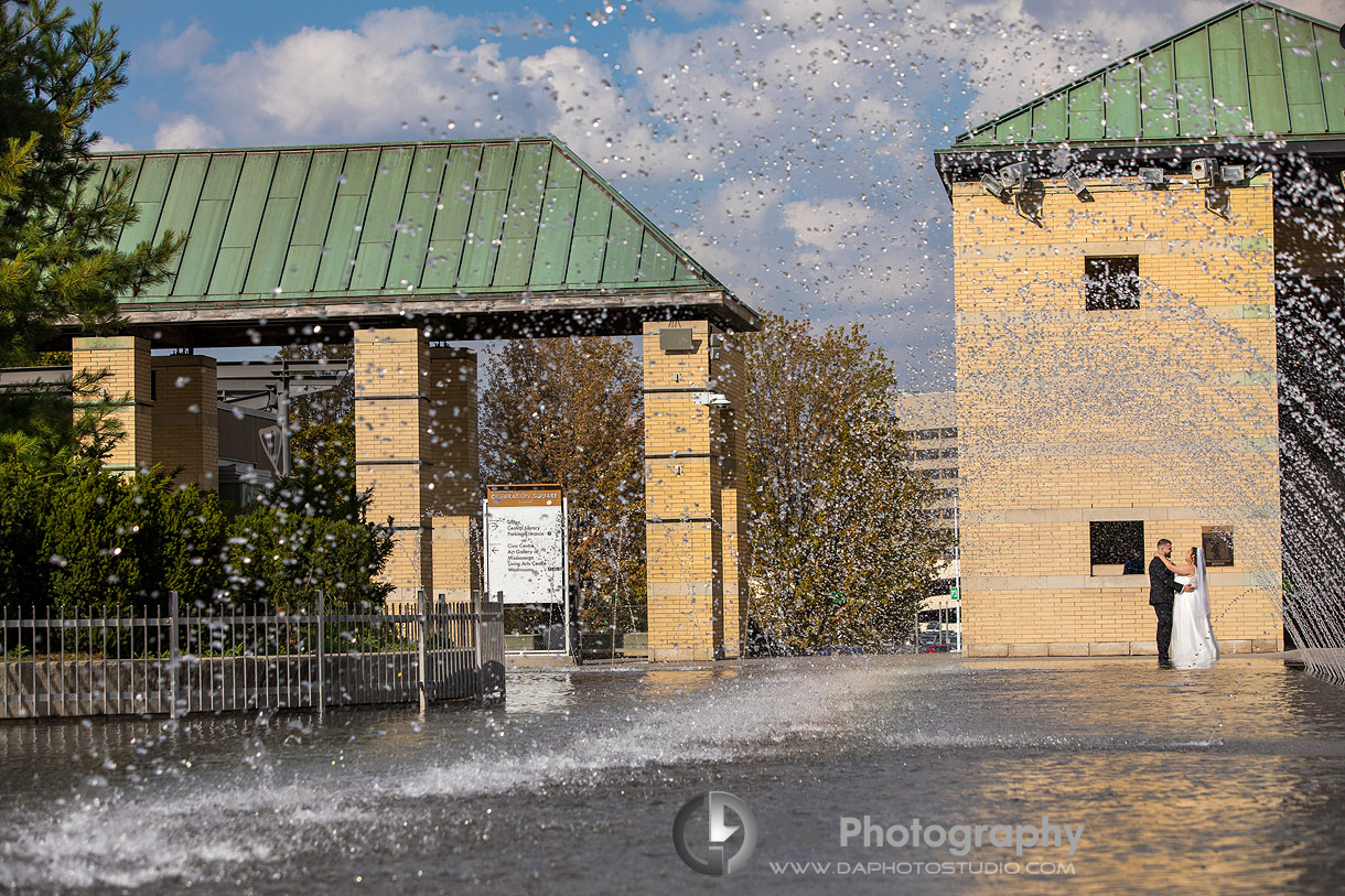 Creative Photo of a Bride and Groom by the fountain at Mississauga City Hall Creative Photo of a Bride and Groom by the fountain at Mississauga City Hall