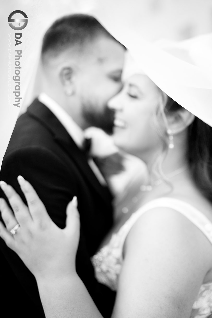 Black and white photo with motion blur effect of a bride and groom having fun during a photo session Black and white photo with motion blur effect of a bride and groom having fun during a photo session