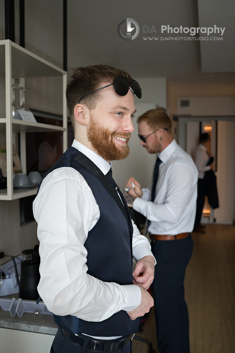 Photographs of a groom getting ready at Pearle Hotel and Spa