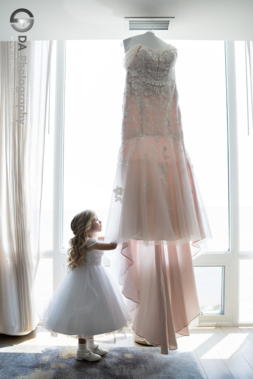 Photo of a Flower girl fixing Wedding Dress at Pearle Hotel and Spa