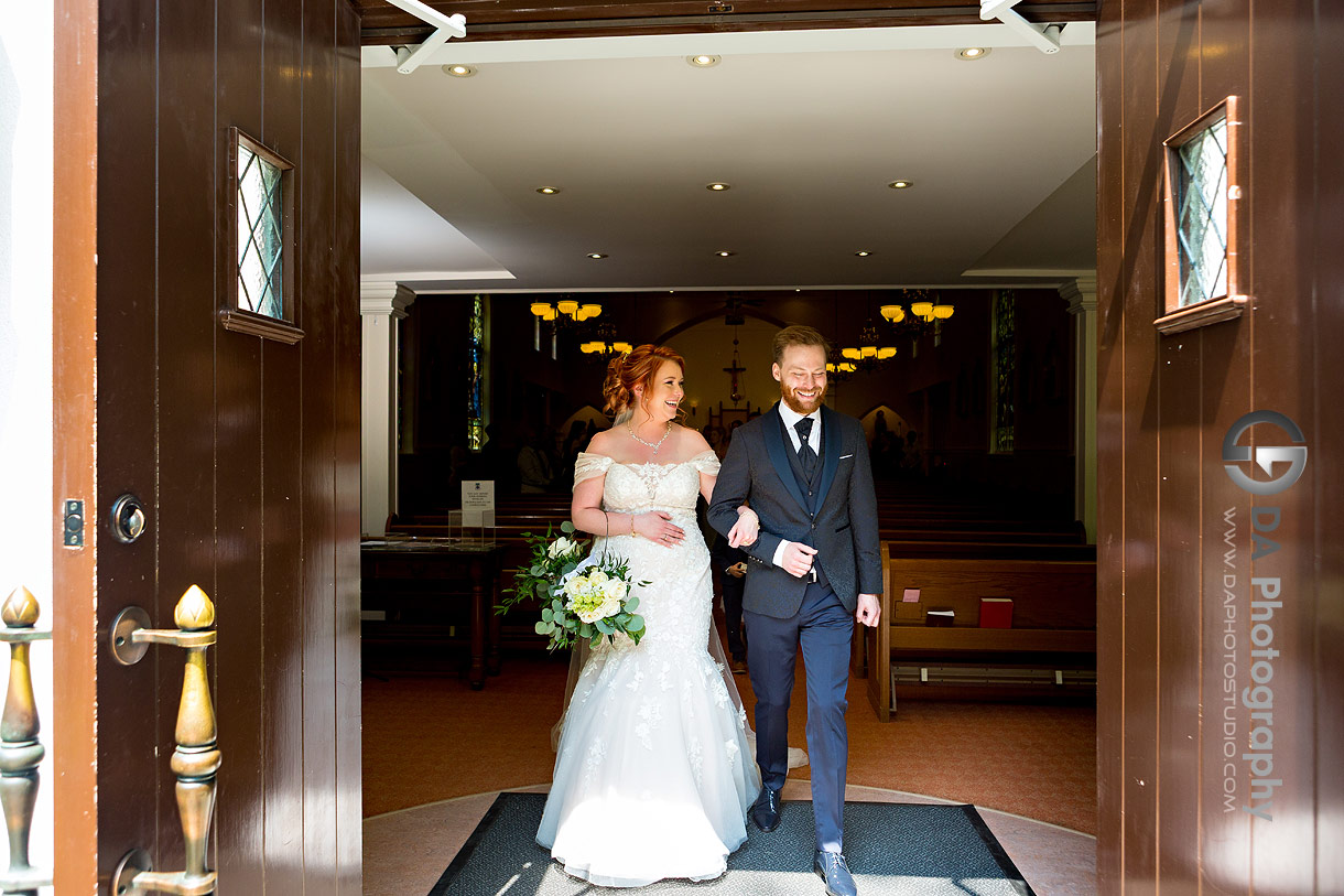 Bride and groom exiting church wedding ceremony in Oakville