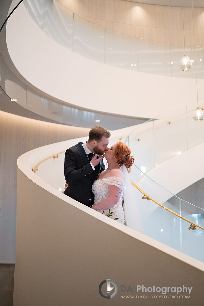 Bride and Groom on the stairs at Pearle Hotel and Spa in Burlington 